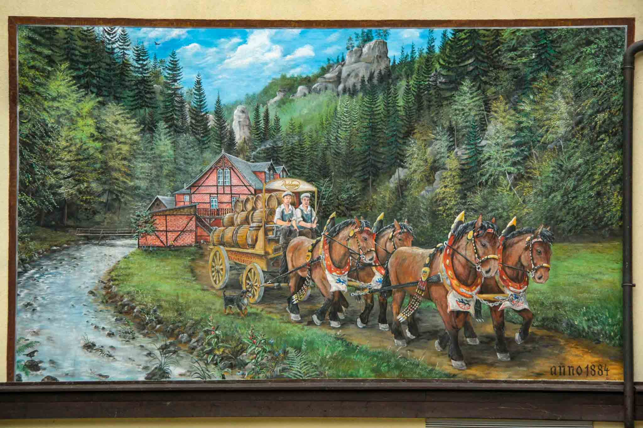 day 2 - lehrpfad hohenstein, painting of a horse coach with beer, leaving a tavern on a river, with the Bastei Brücke towering in the back